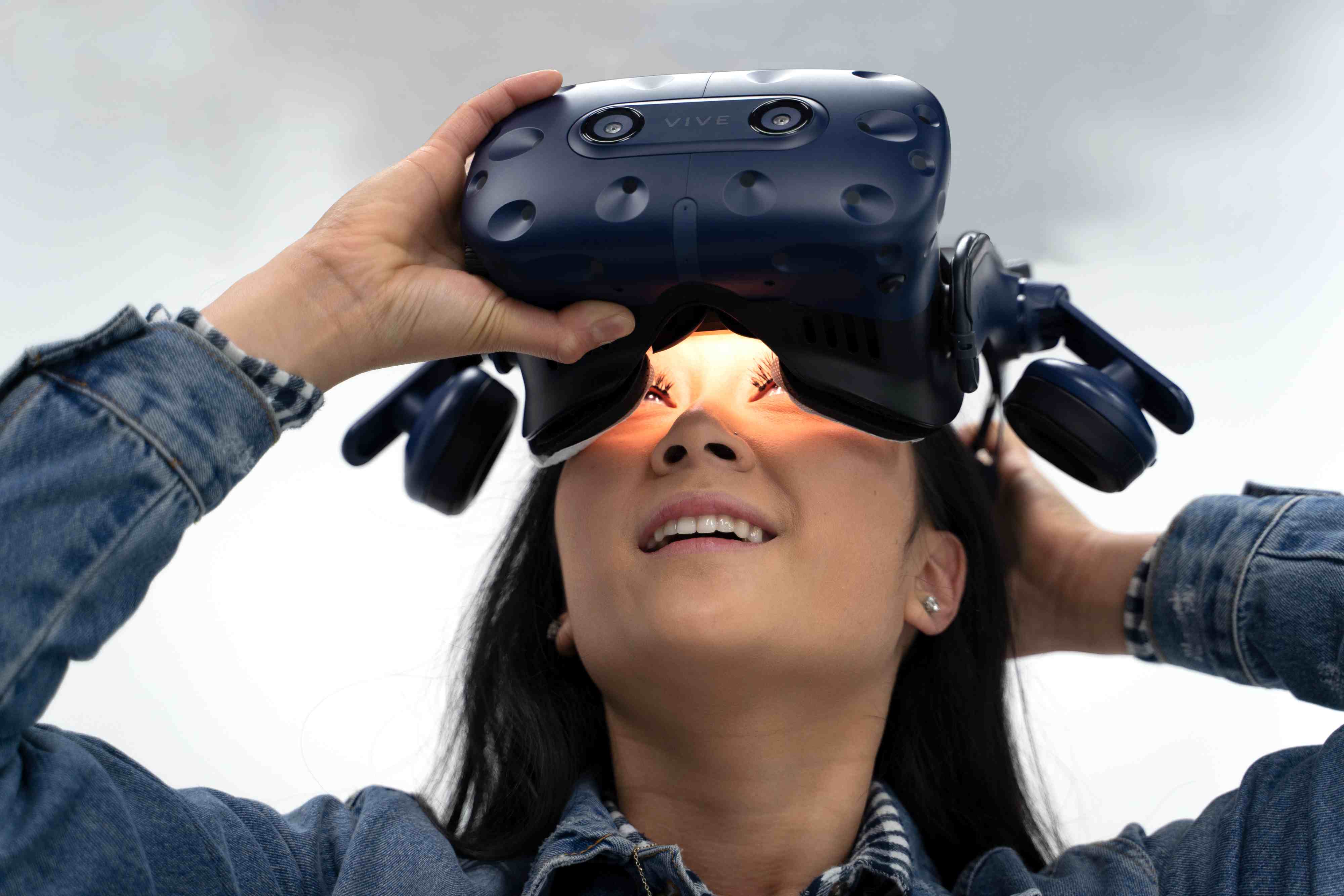 Woman putting on a VR headset